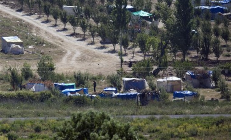 A deserted makeshift camp where some dozens of Syrians were staying, is nearly deserted after Syrian troops arrived on Thursday, next to a crossing point near the Turkish village of Guvecci in Hatay province, Turkey, Friday, June 24, 2011.   Most of the displaced Syrians at this encampment entered Turkey in a hurry as they saw Syrian troops arriving.(AP Photo/Burhan Ozbilici)